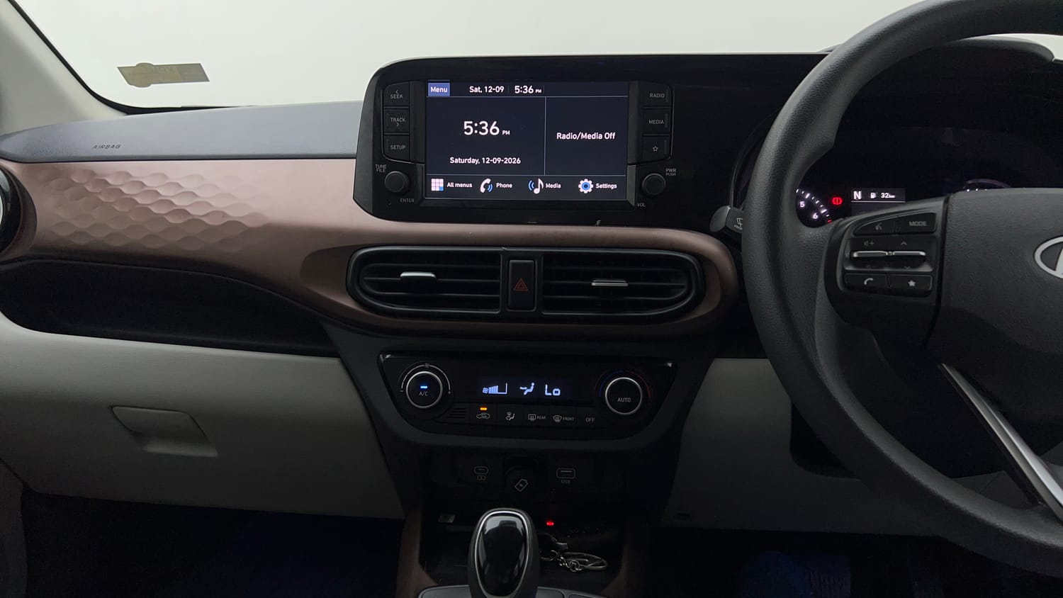 Used 2024 Hyundai Aura SX Plus 1.2 AMT Petrol Petrol Automatic interior MUSIC SYSTEM & AC CONTROL VIEW