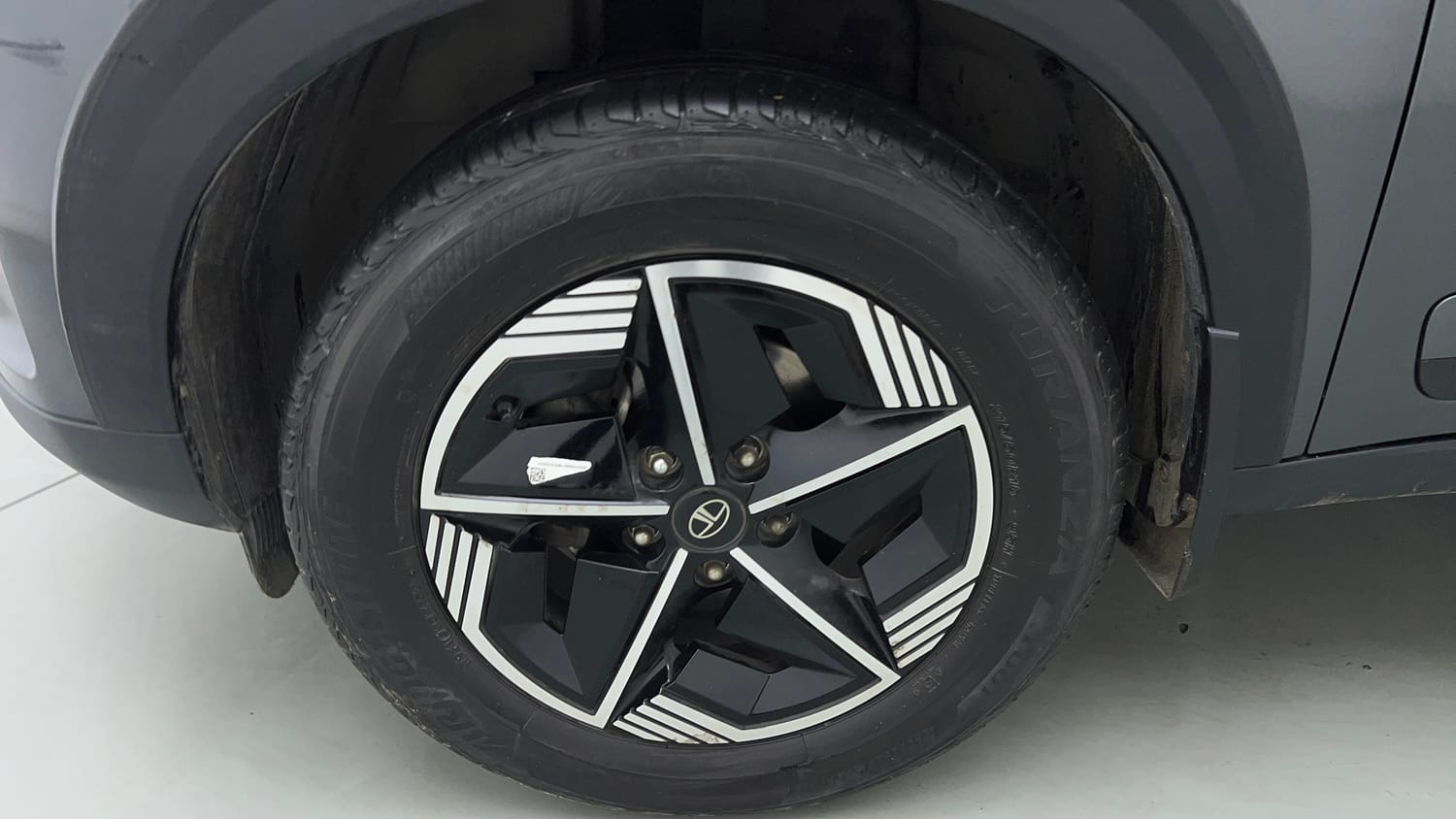 Used 2024 tata Nexon Fearless S 1.2 Revotron Petrol 7DCA Dual Tone Petrol Automatic tyres LEFT FRONT TYRE RIM VIEW