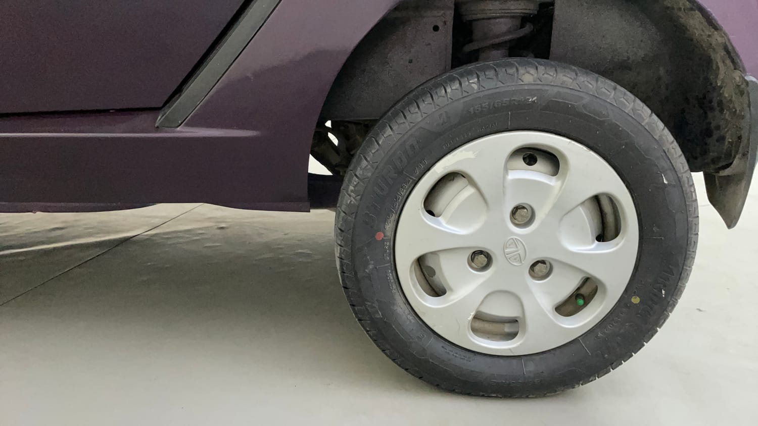Used 2015 Tata Nano Twist XT Petrol Manual tyres LEFT REAR TYRE RIM VIEW
