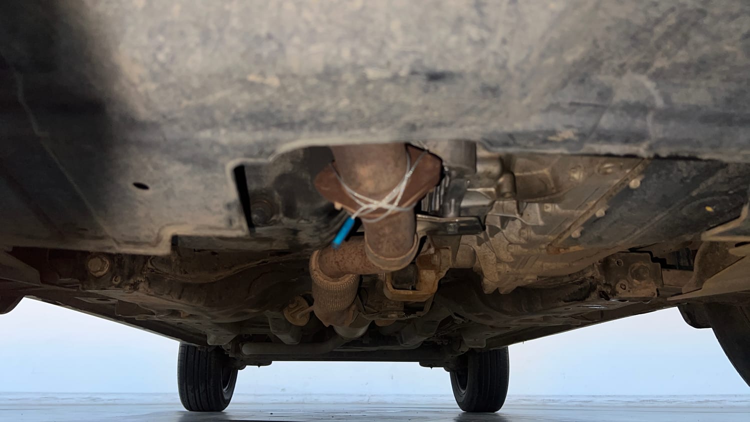 Used 2024 tata Nexon Fearless S 1.2 Revotron Petrol 7DCA Dual Tone Petrol Automatic extra FRONT LEFT UNDERBODY VIEW