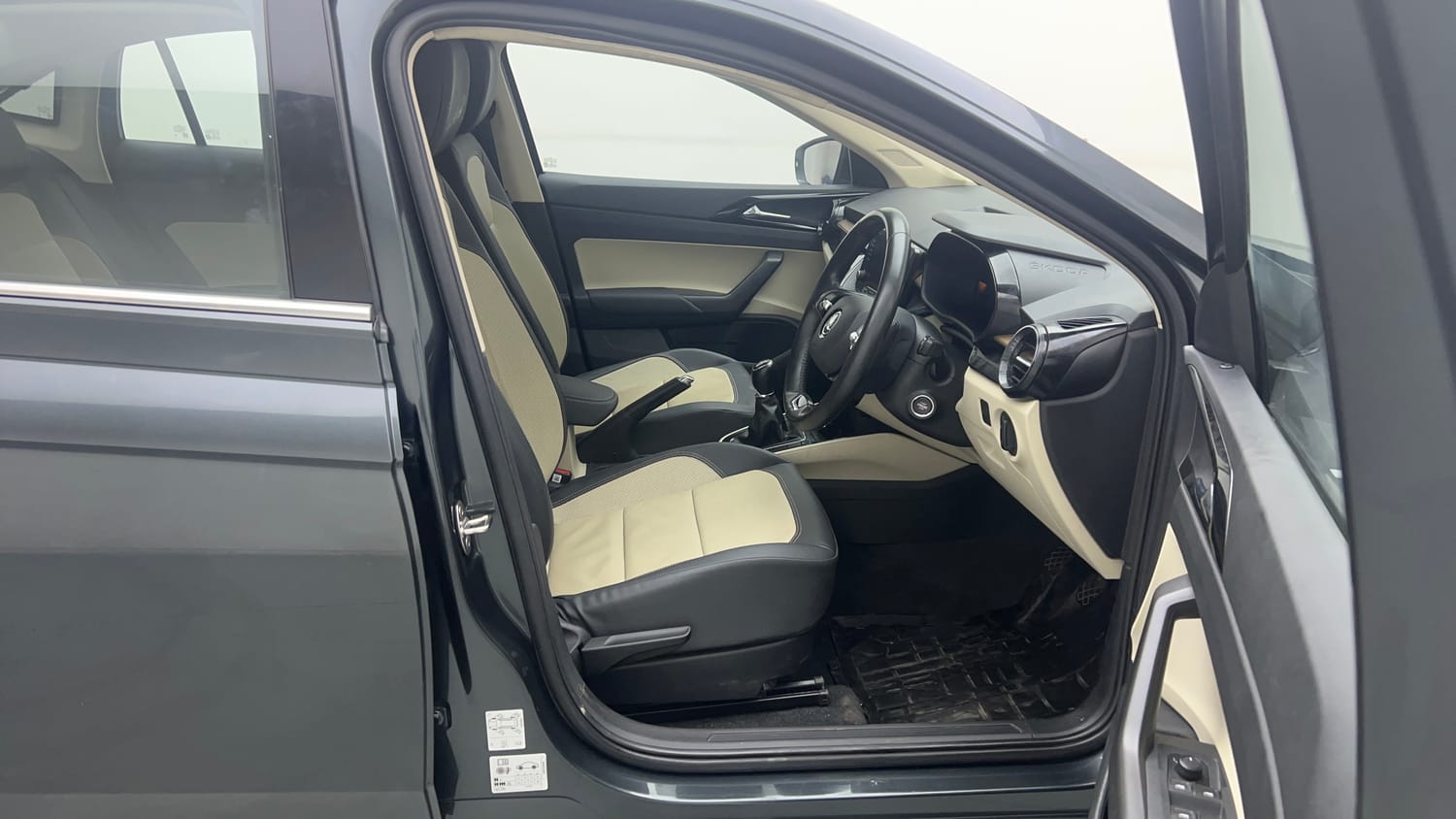 Used 2023 Skoda Slavia Style 1.0L TSI MT Petrol Manual interior RIGHT SIDE FRONT DOOR CABIN VIEW