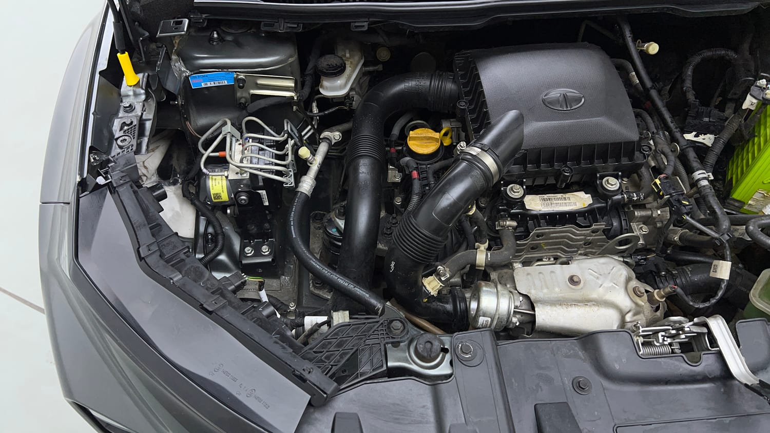 Used 2024 tata Nexon Fearless S 1.2 Revotron Petrol 7DCA Dual Tone Petrol Automatic engine ENGINE RIGHT SIDE VIEW
