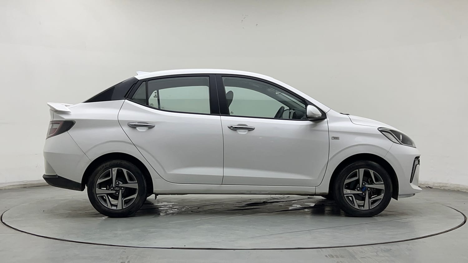 Used 2024 Hyundai Aura SX Plus 1.2 AMT Petrol Petrol Automatic exterior RIGHT SIDE VIEW