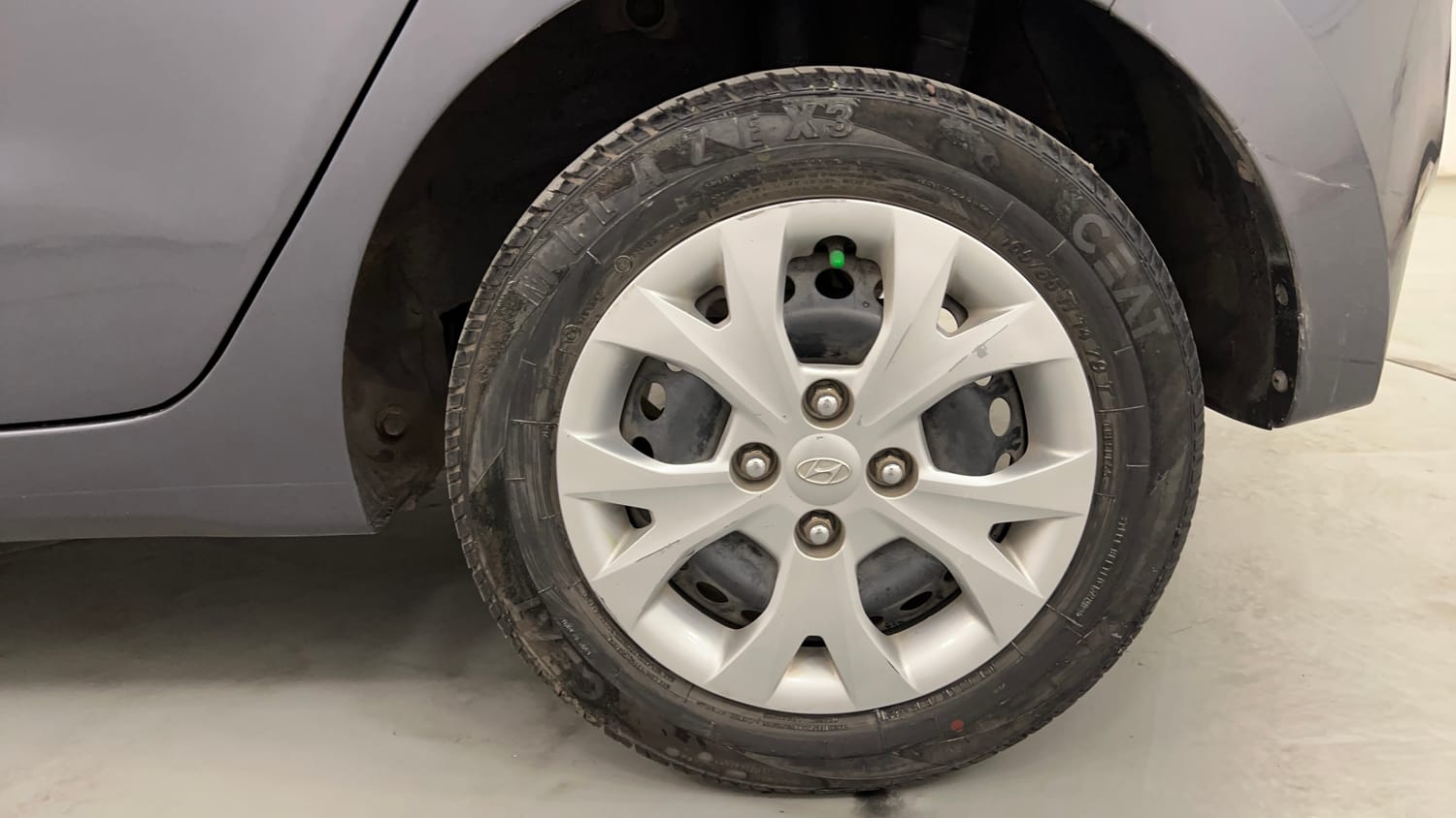 Used 2014 Hyundai Grand i10 Magna 1.2 Kappa VTVT Petrol Manual tyres LEFT REAR TYRE RIM VIEW