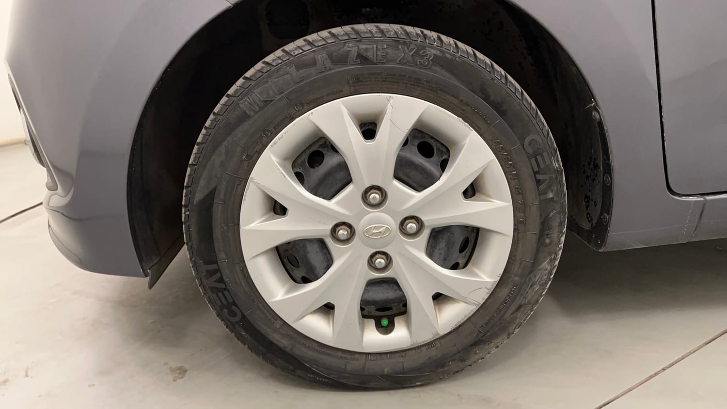 Used 2014 Hyundai Grand i10 Magna 1.2 Kappa VTVT Petrol Manual tyres LEFT FRONT TYRE RIM VIEW