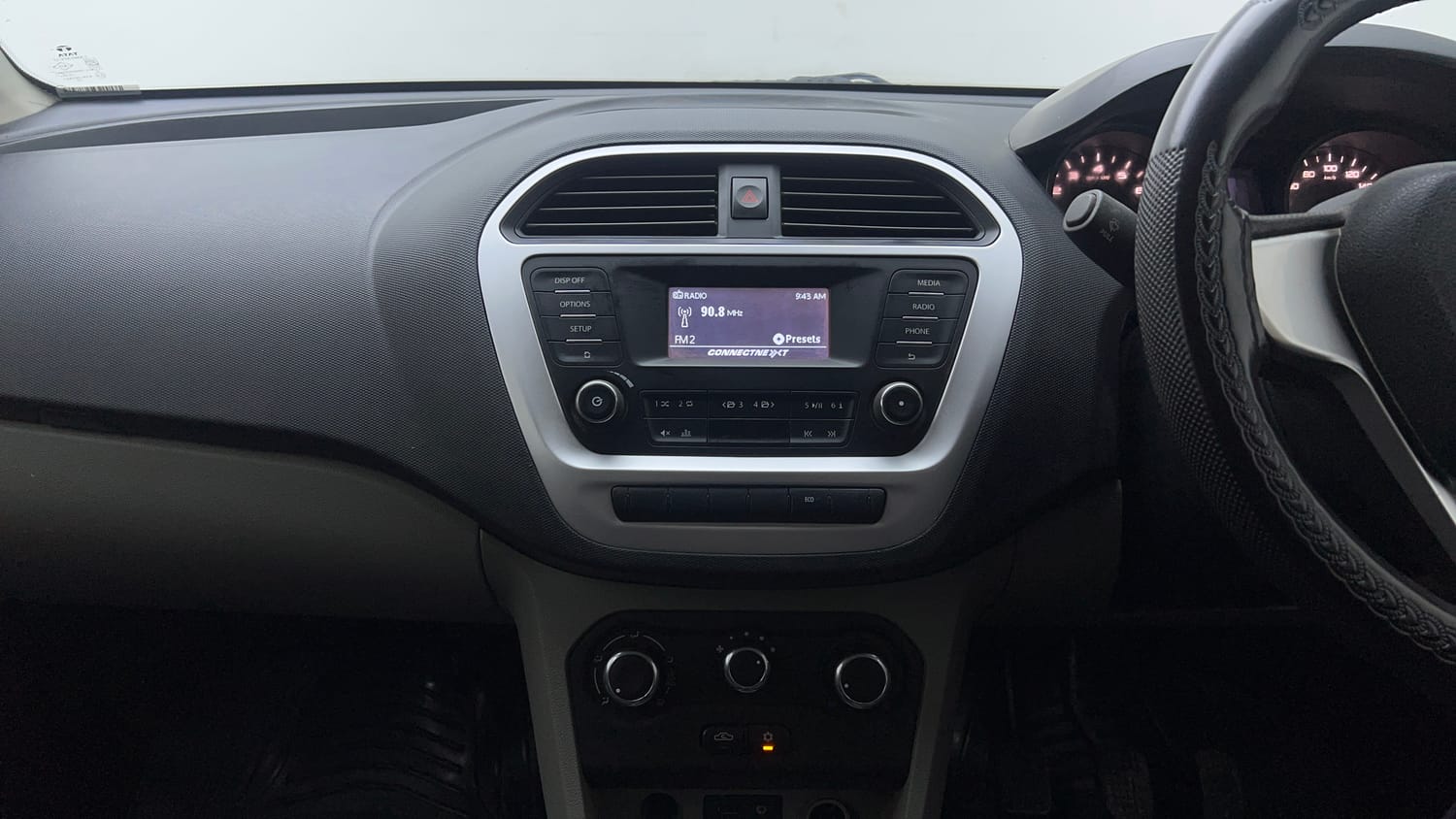 Used 2017 Tata Tiago Revotron XT Petrol Manual top_features Integrated (in-dash) music system