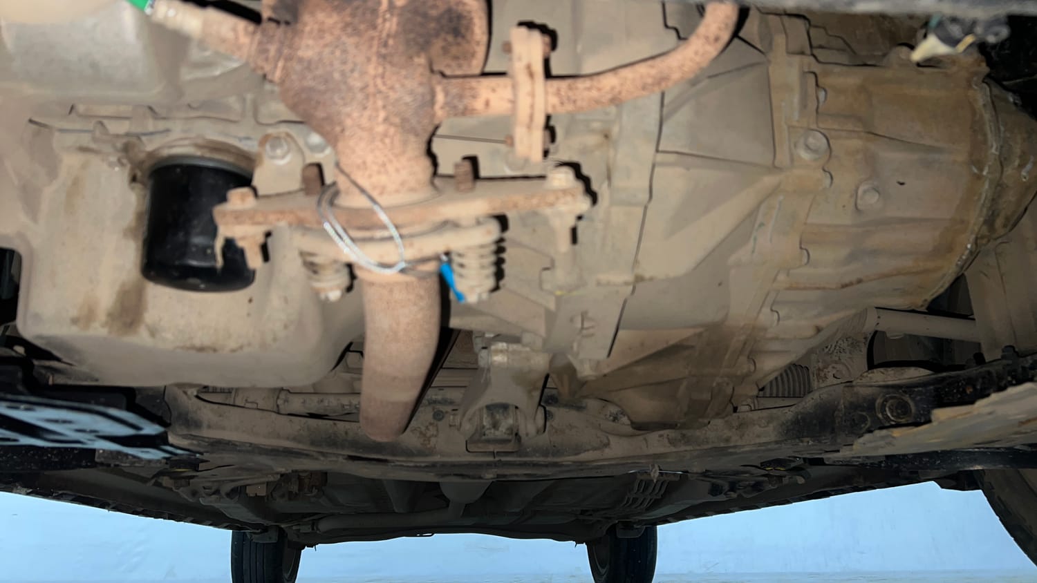 Used 2023 Maruti Suzuki XL6 Zeta MT CNG Cng Manual extra FRONT LEFT UNDERBODY VIEW