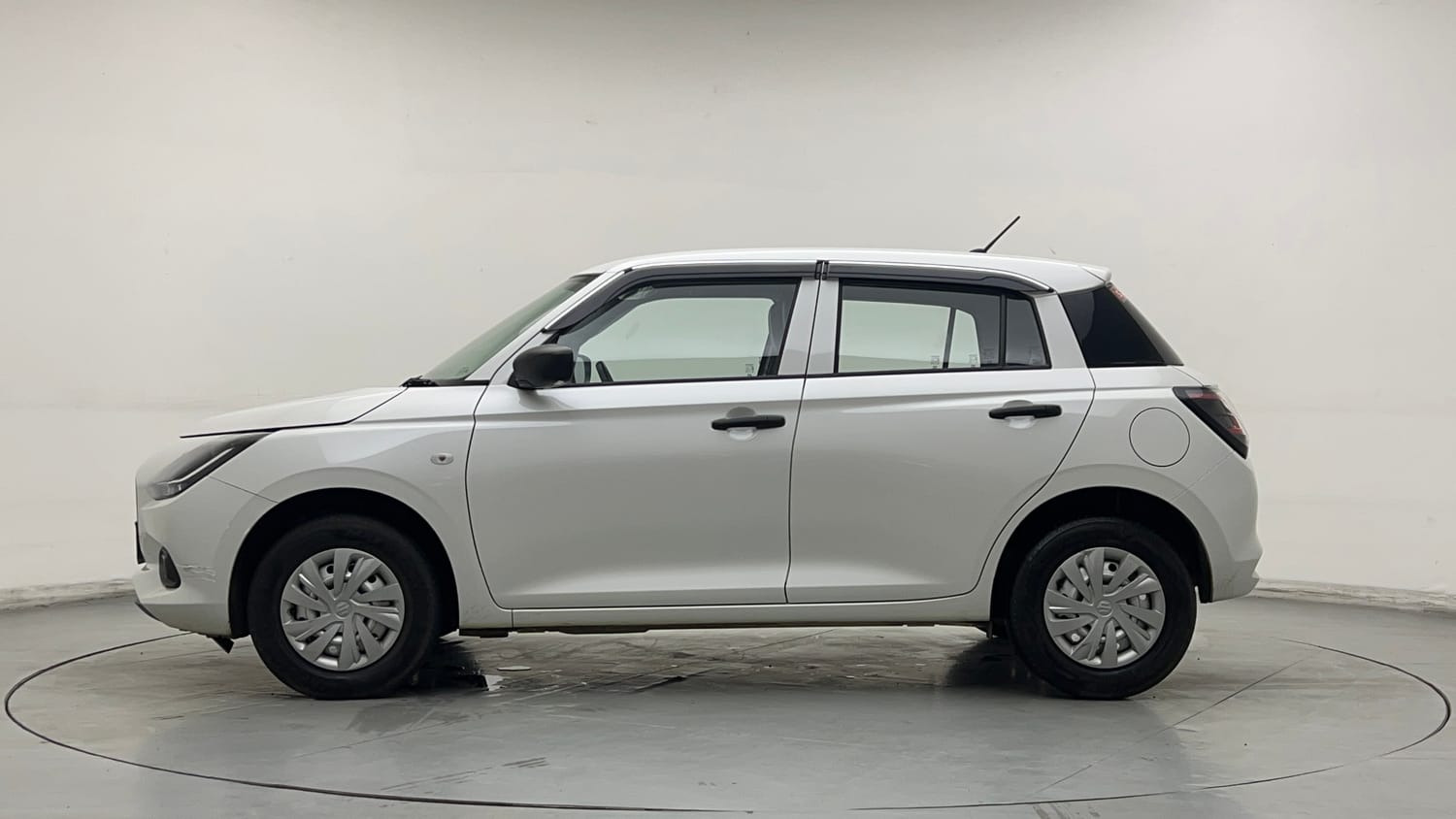 Used 2026 Maruti Suzuki Swift LXi Petrol Manual exterior LEFT SIDE VIEW