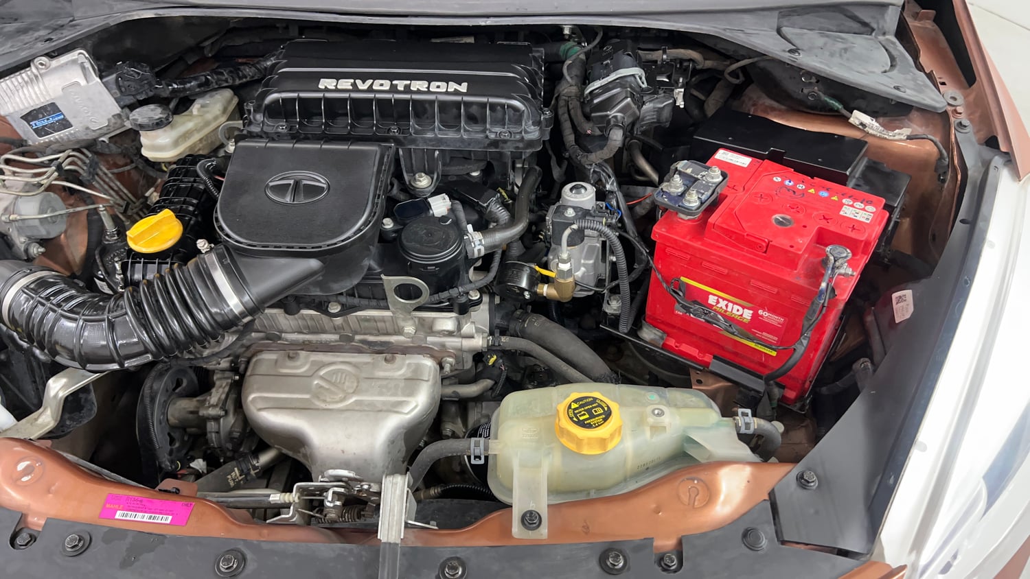 Used 2018 Tata Tigor Revotron XT Petrol + CNG (Outside Fitted) Cng Manual engine ENGINE LEFT SIDE VIEW