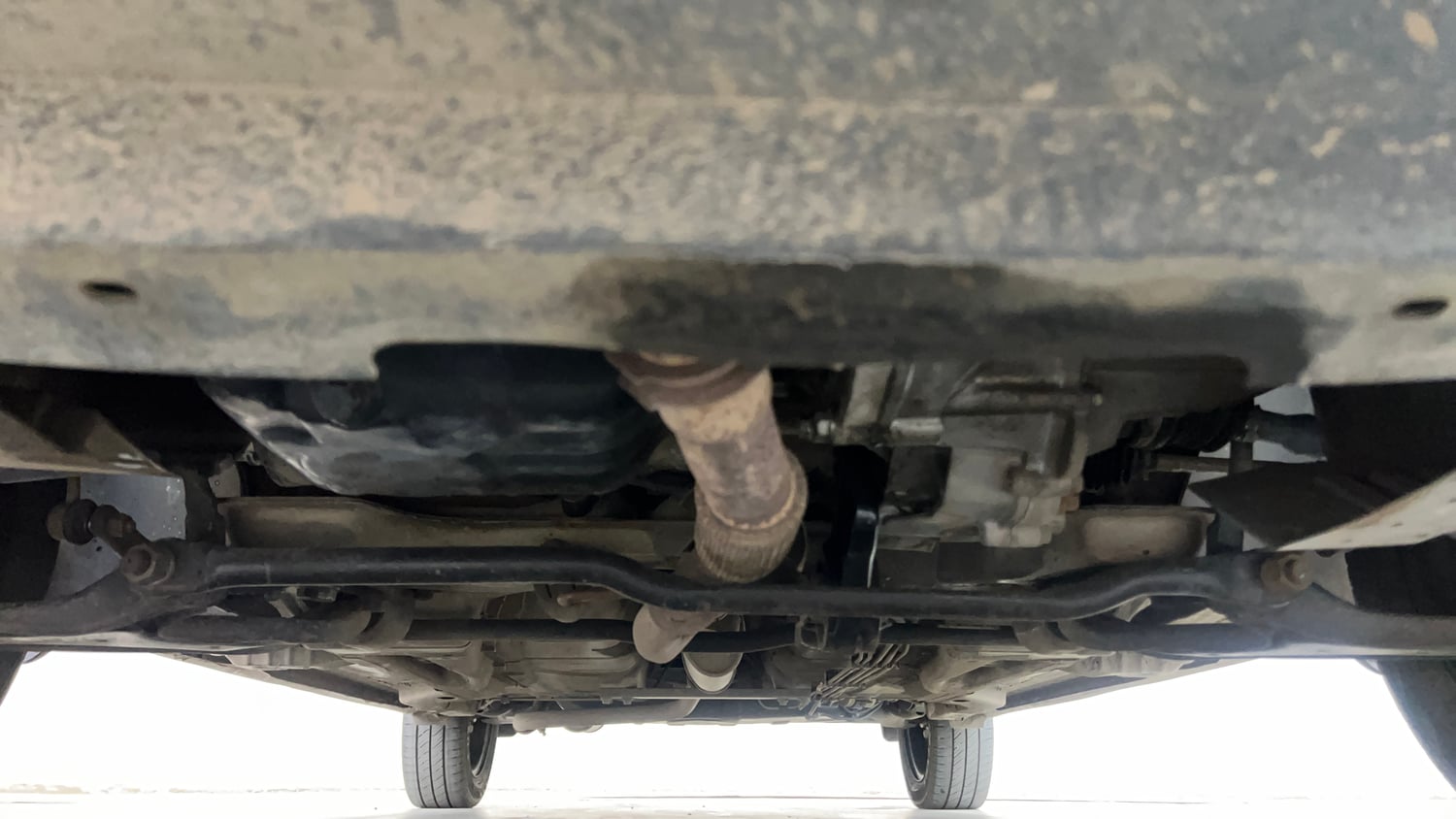 Used 2018 Tata Tigor Revotron XT Petrol + CNG (Outside Fitted) Cng Manual extra FRONT LEFT UNDERBODY VIEW
