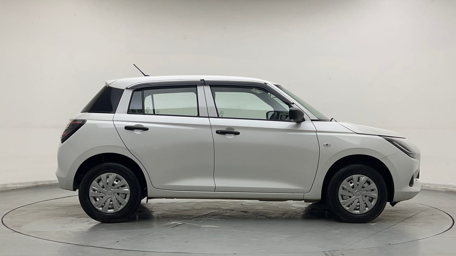 Used 2026 Maruti Suzuki Swift LXi Petrol Manual exterior RIGHT SIDE VIEW