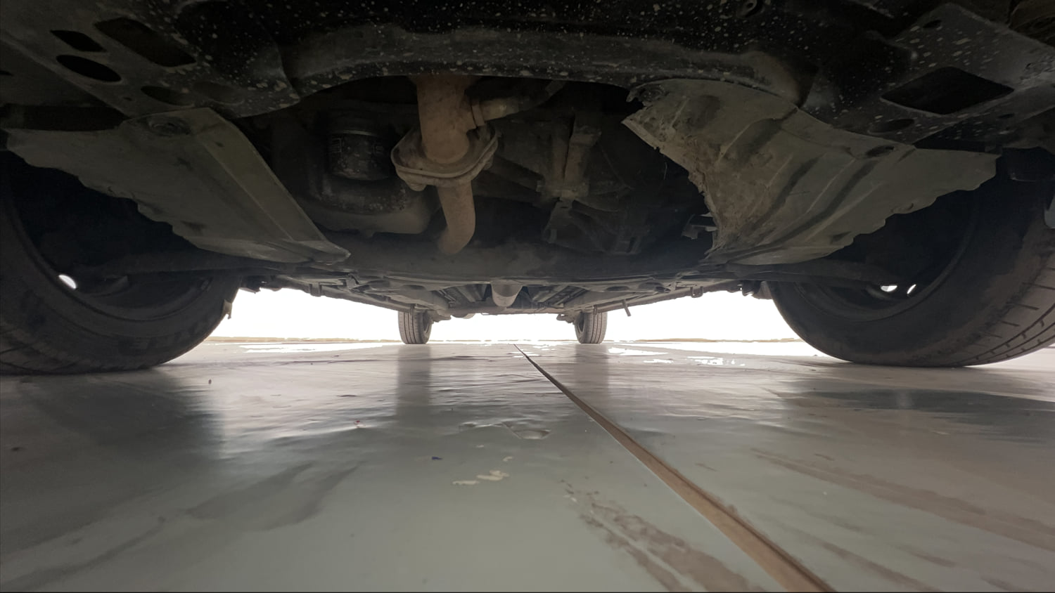 Used 2013 Maruti Suzuki Ertiga Vxi Petrol Manual extra FRONT LEFT UNDERBODY VIEW