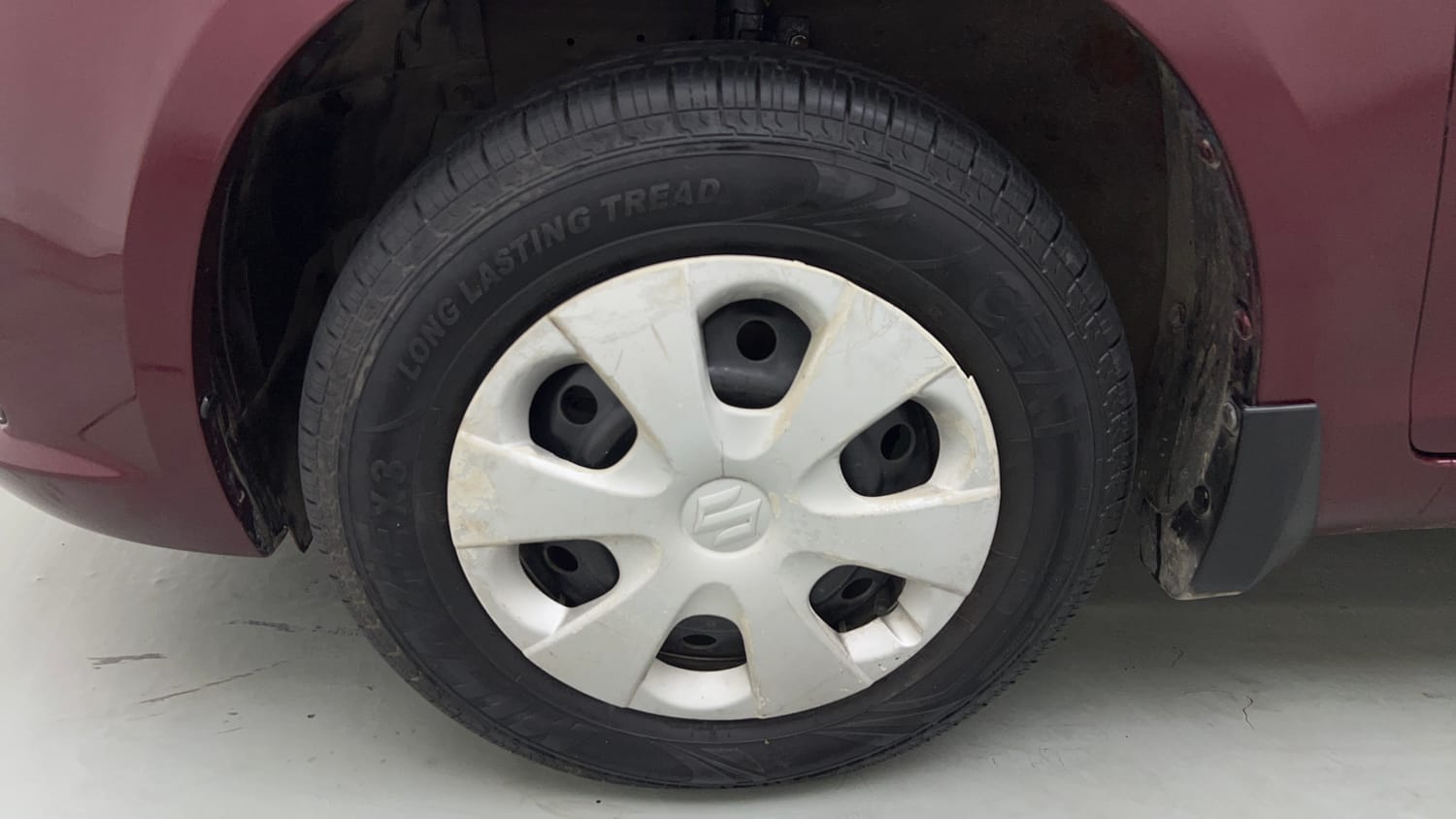 Used 2015 Maruti Suzuki Swift Dzire VXI Petrol Manual tyres LEFT FRONT TYRE RIM VIEW