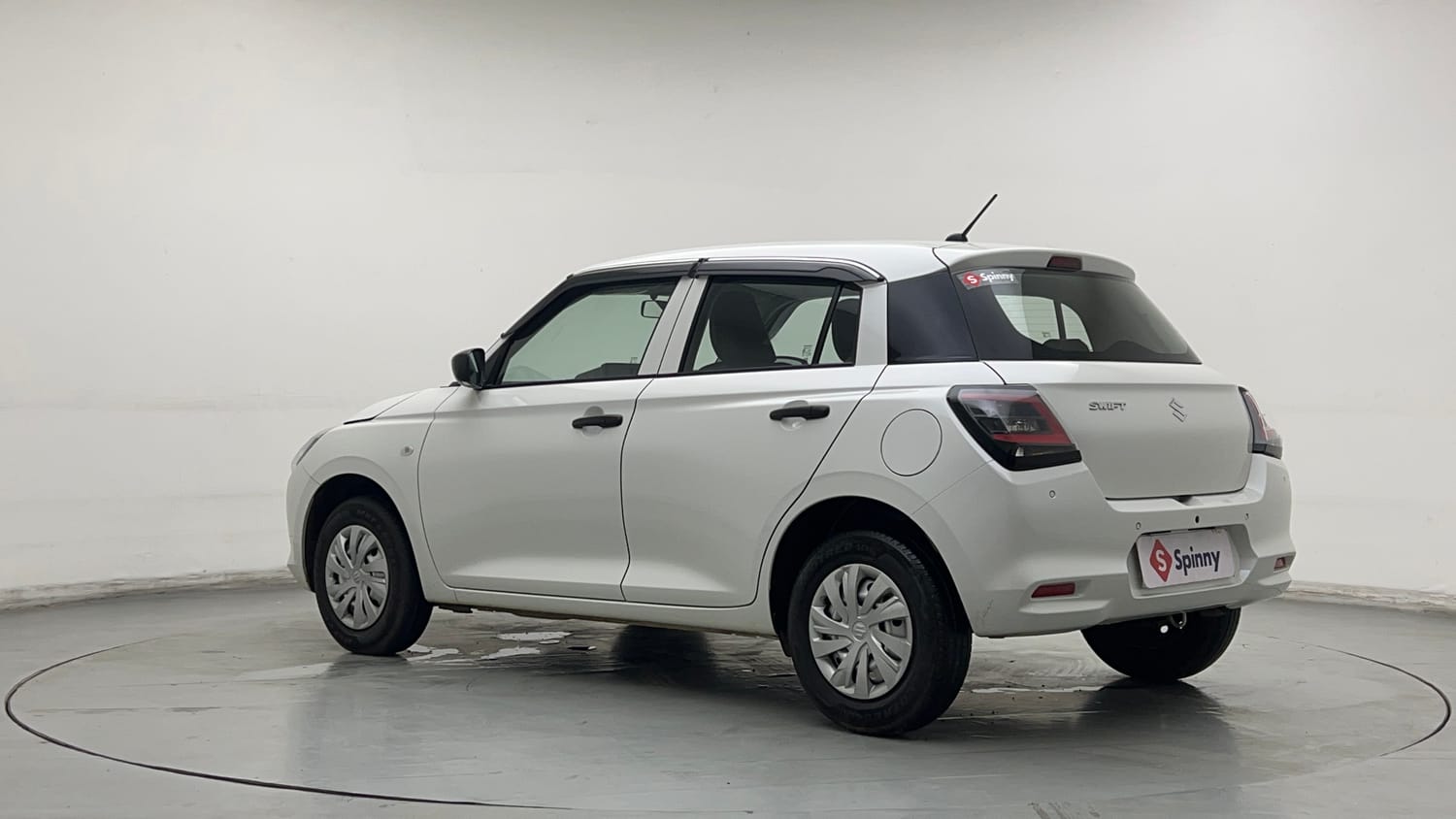 Used 2026 Maruti Suzuki Swift LXi Petrol Manual exterior LEFT REAR CORNER VIEW