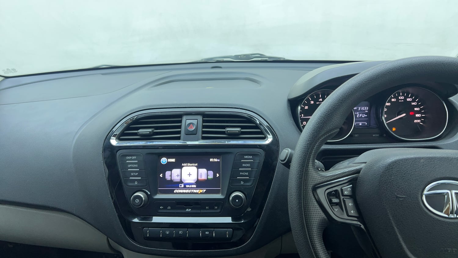 Used 2019 Tata Tiago Revotron XZ w/o Alloy Petrol Manual top_features Integrated (in-dash) music system