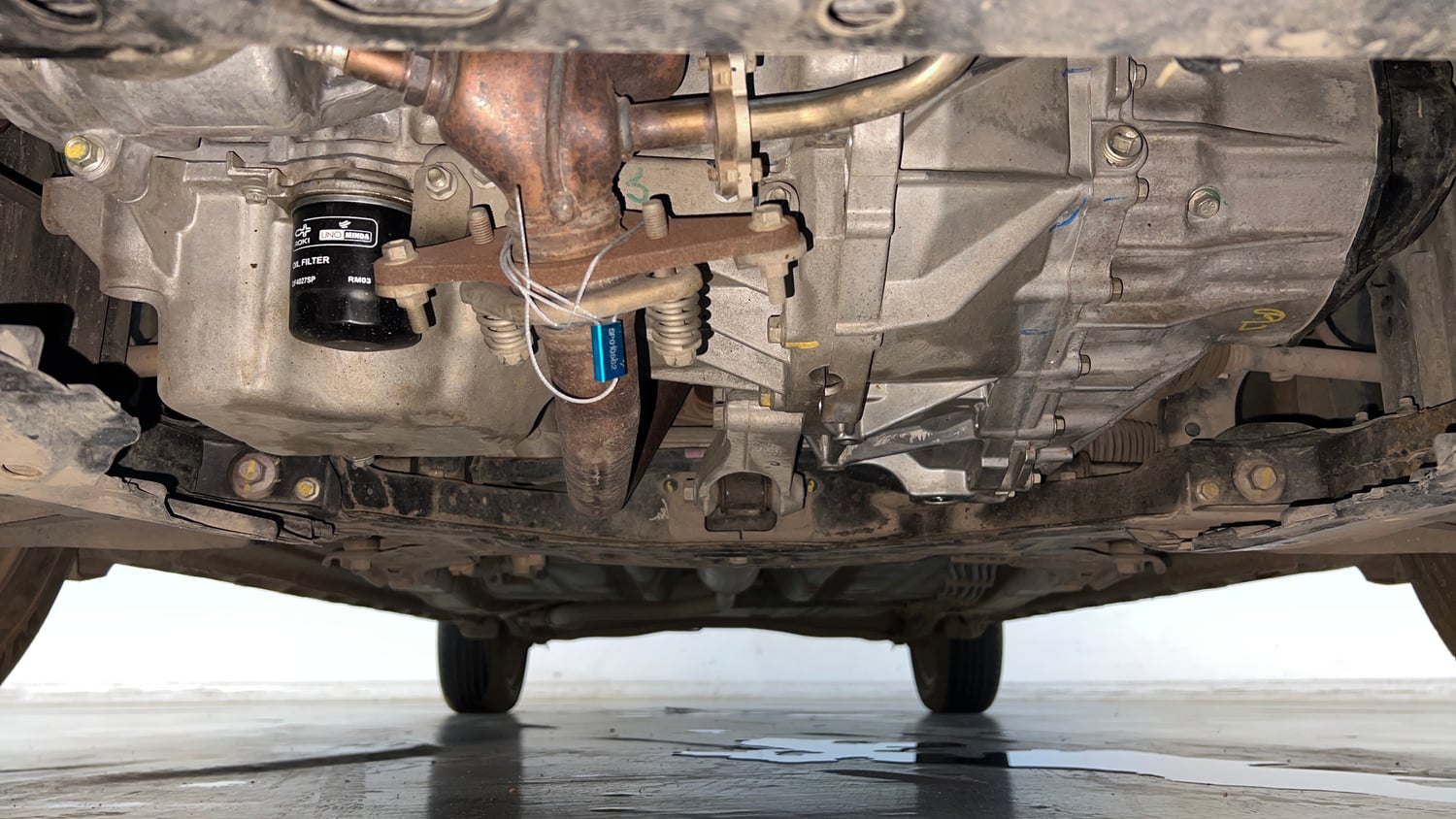 Used 2024 Maruti Suzuki XL6 Zeta MT CNG Cng Manual extra FRONT LEFT UNDERBODY VIEW