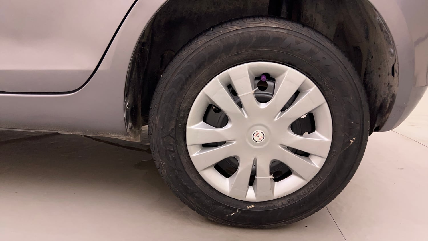 Used 2014 Maruti Suzuki Swift VXi Petrol Manual tyres LEFT REAR TYRE RIM VIEW
