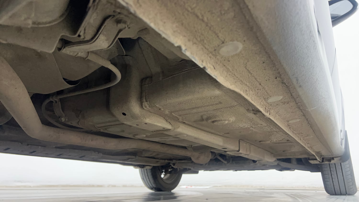 Used 2024 Hyundai Aura SX 1.2 CNG Cng Manual extra REAR RIGHT UNDERBODY VIEW
