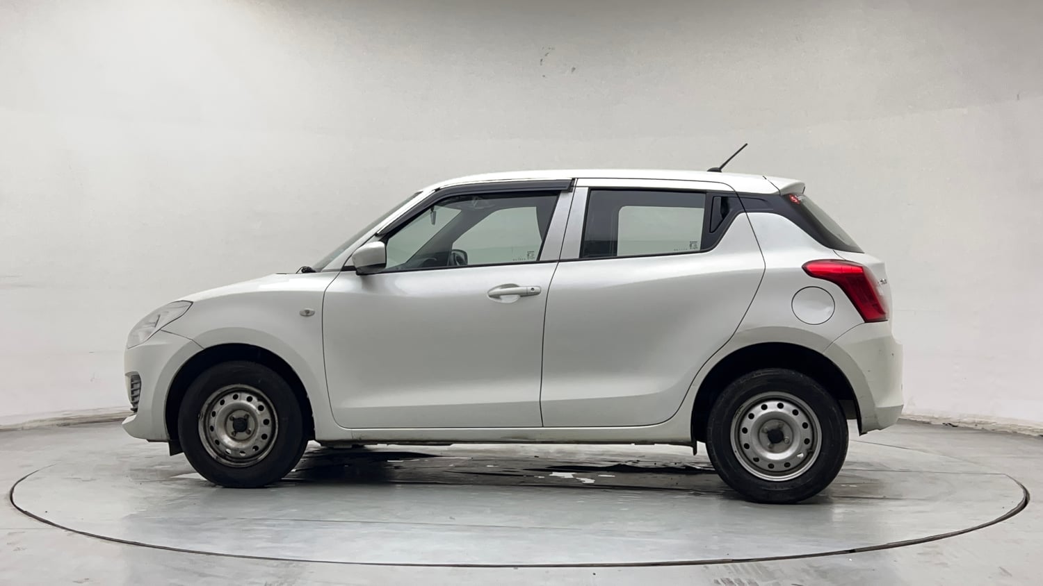 Used 2023 Maruti Suzuki Swift LXi Petrol Manual exterior LEFT SIDE VIEW