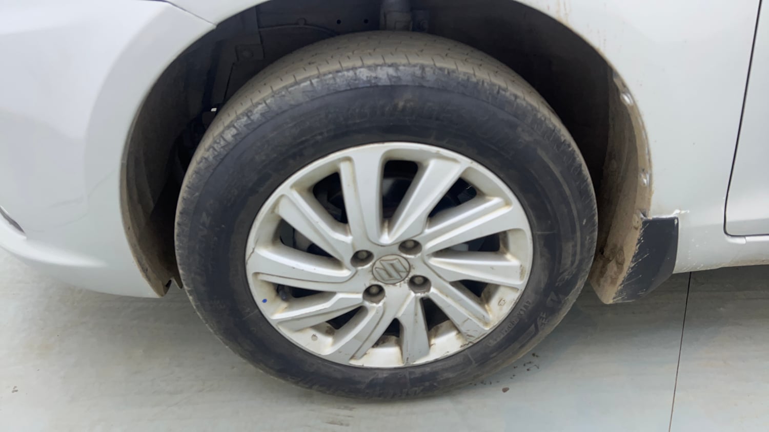 Used 2015 Maruti Suzuki Swift Dzire ZXI Petrol Manual tyres LEFT FRONT TYRE RIM VIEW