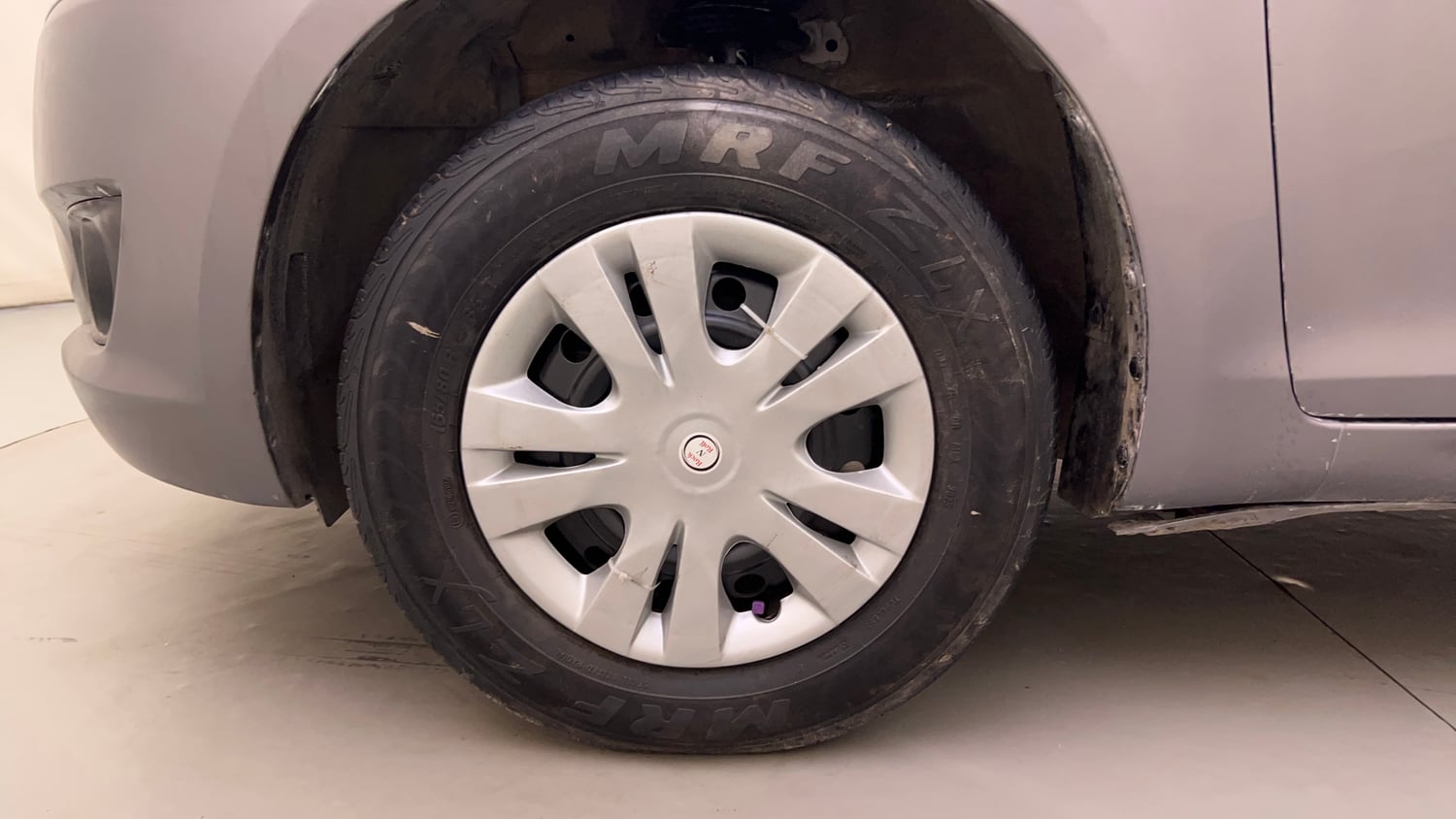 Used 2014 Maruti Suzuki Swift VXi Petrol Manual tyres LEFT FRONT TYRE RIM VIEW