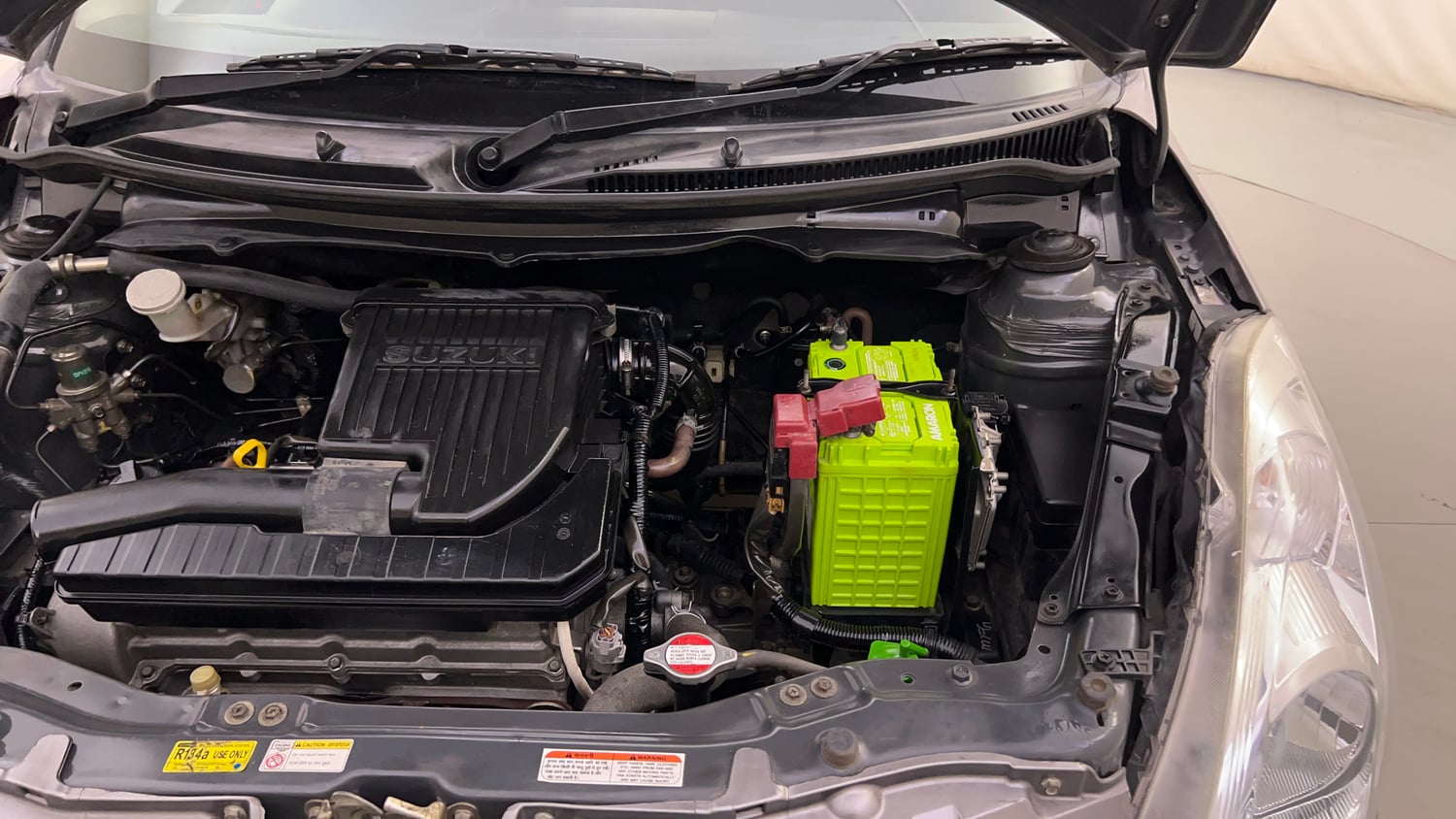 Used 2014 Maruti Suzuki Swift VXi Petrol Manual engine ENGINE LEFT SIDE HINGE & APRON VIEW