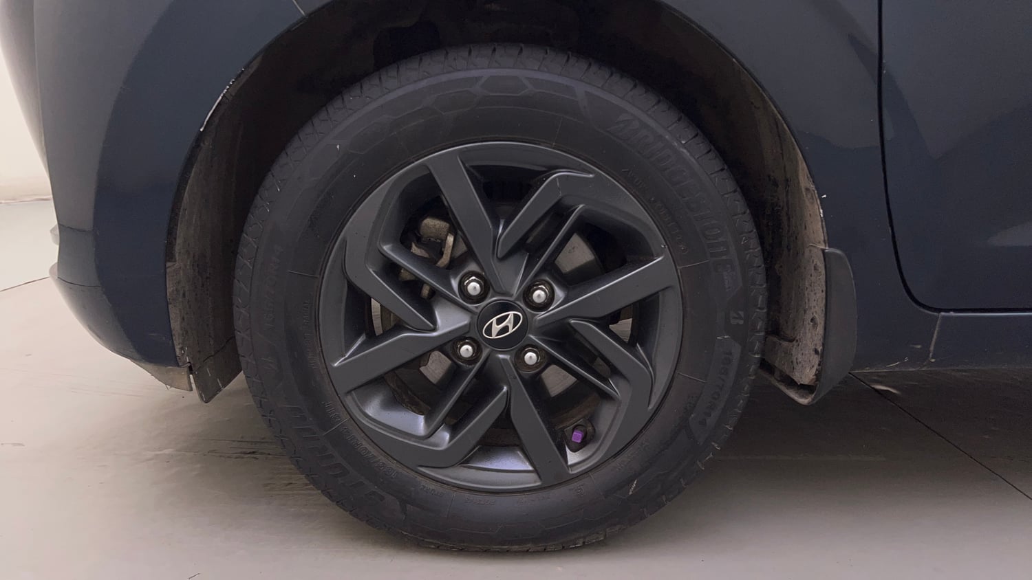 Used 2021 Hyundai Grand i10 Nios Sportz AMT 1.2 Kappa VTVT Petrol Automatic tyres LEFT FRONT TYRE RIM VIEW
