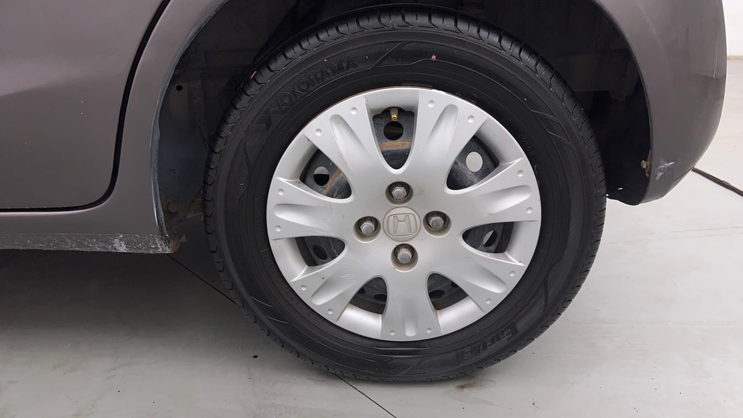 Used 2013 Honda Brio S MT Petrol Manual tyres LEFT REAR TYRE RIM VIEW