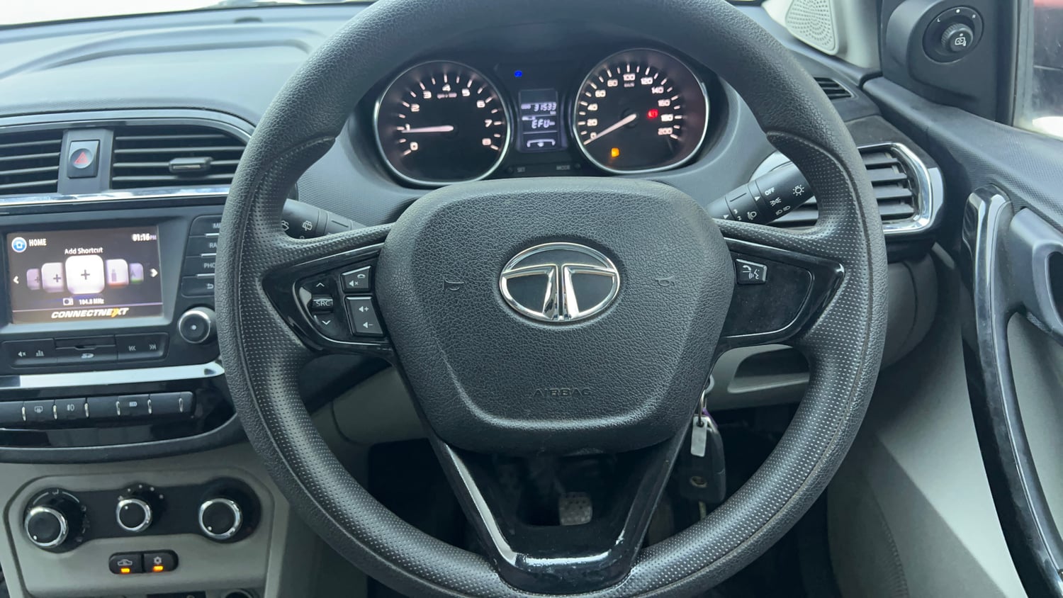Used 2019 Tata Tiago Revotron XZ w/o Alloy Petrol Manual top_features Steering mounted controls