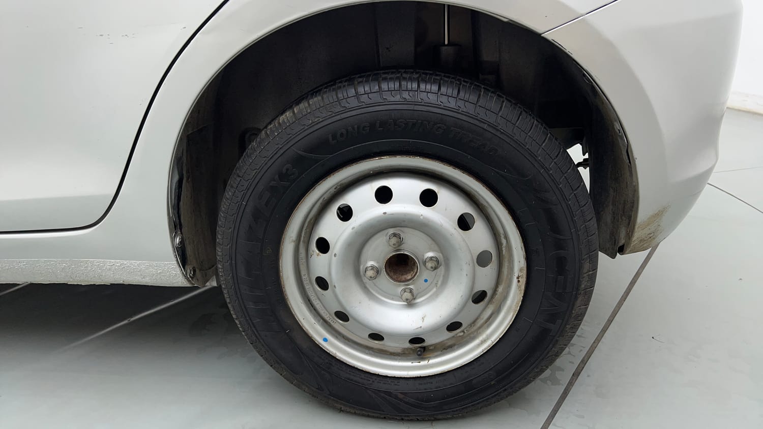 Used 2013 Maruti Suzuki Swift LXi Petrol Manual tyres LEFT REAR TYRE RIM VIEW