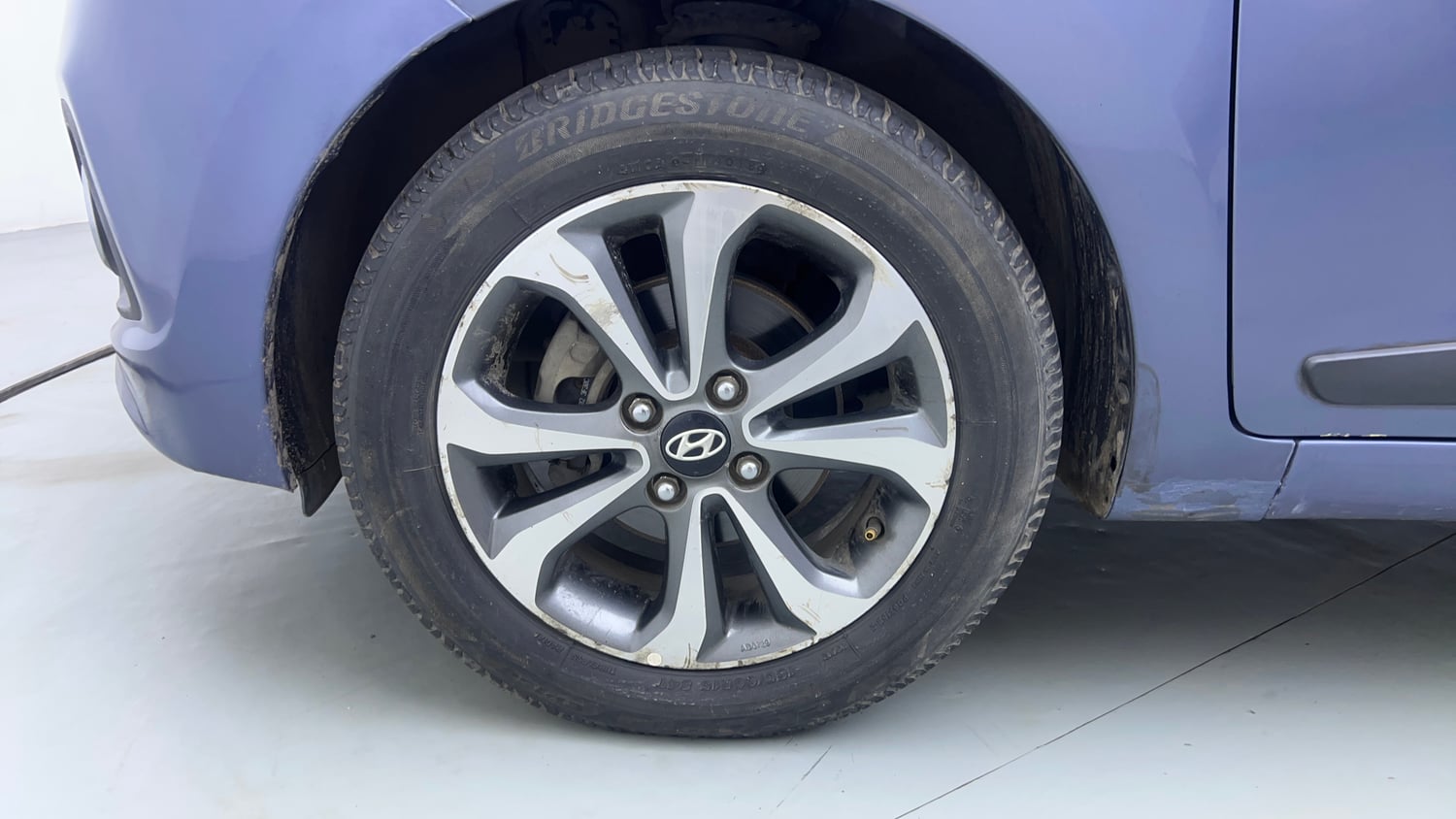 Used 2014 Hyundai Xcent S AT 1.2 (O) Petrol Automatic tyres LEFT FRONT TYRE RIM VIEW
