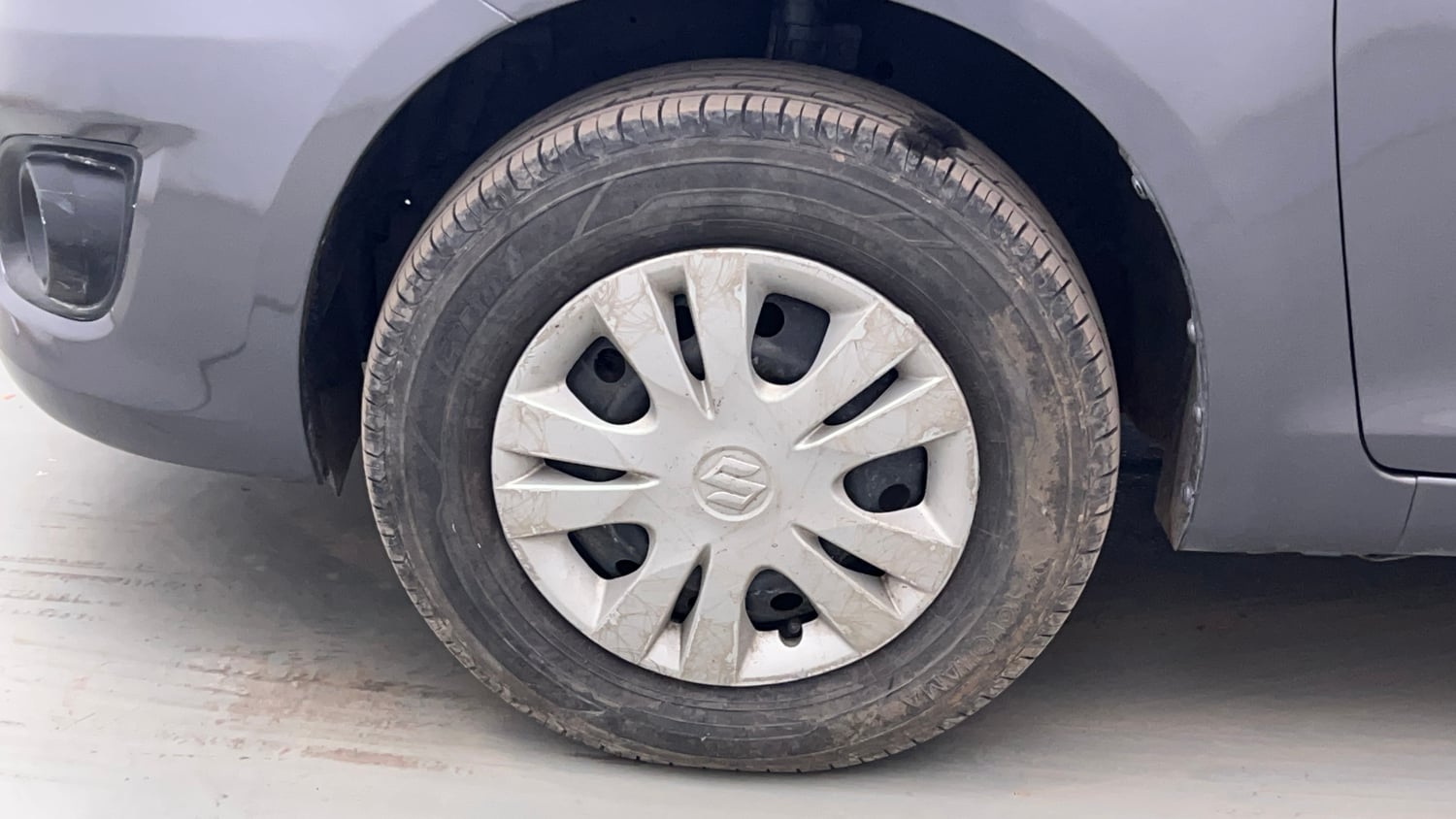 Used 2014 Maruti Suzuki Swift Dzire VXI Petrol Manual tyres LEFT FRONT TYRE RIM VIEW