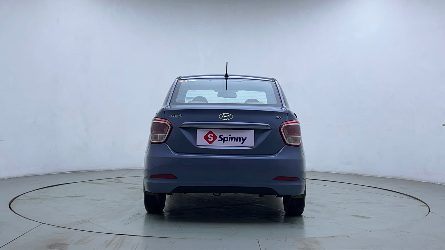 Used 2014 Hyundai Xcent S AT 1.2 (O) Petrol Automatic exterior BACK VIEW