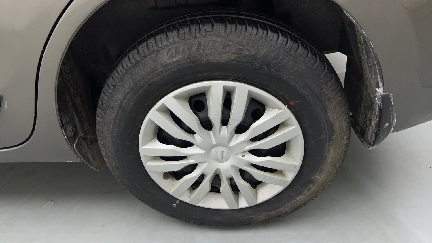 Used 2022 Maruti Suzuki Dzire VXi Petrol Manual tyres LEFT REAR TYRE RIM VIEW