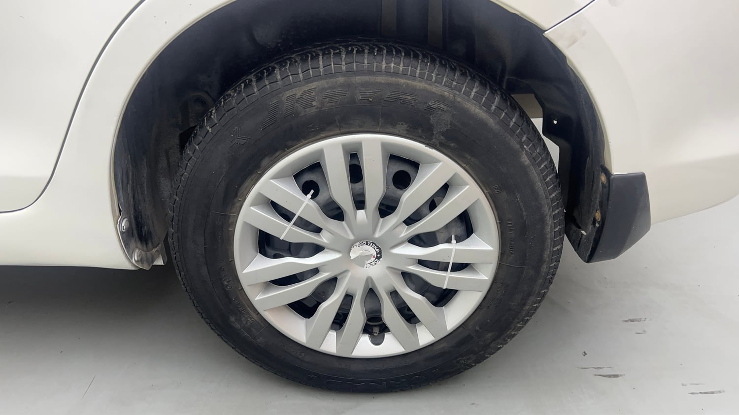 Used 2015 Maruti Suzuki Swift Dzire VXI Petrol Manual tyres LEFT REAR TYRE RIM VIEW
