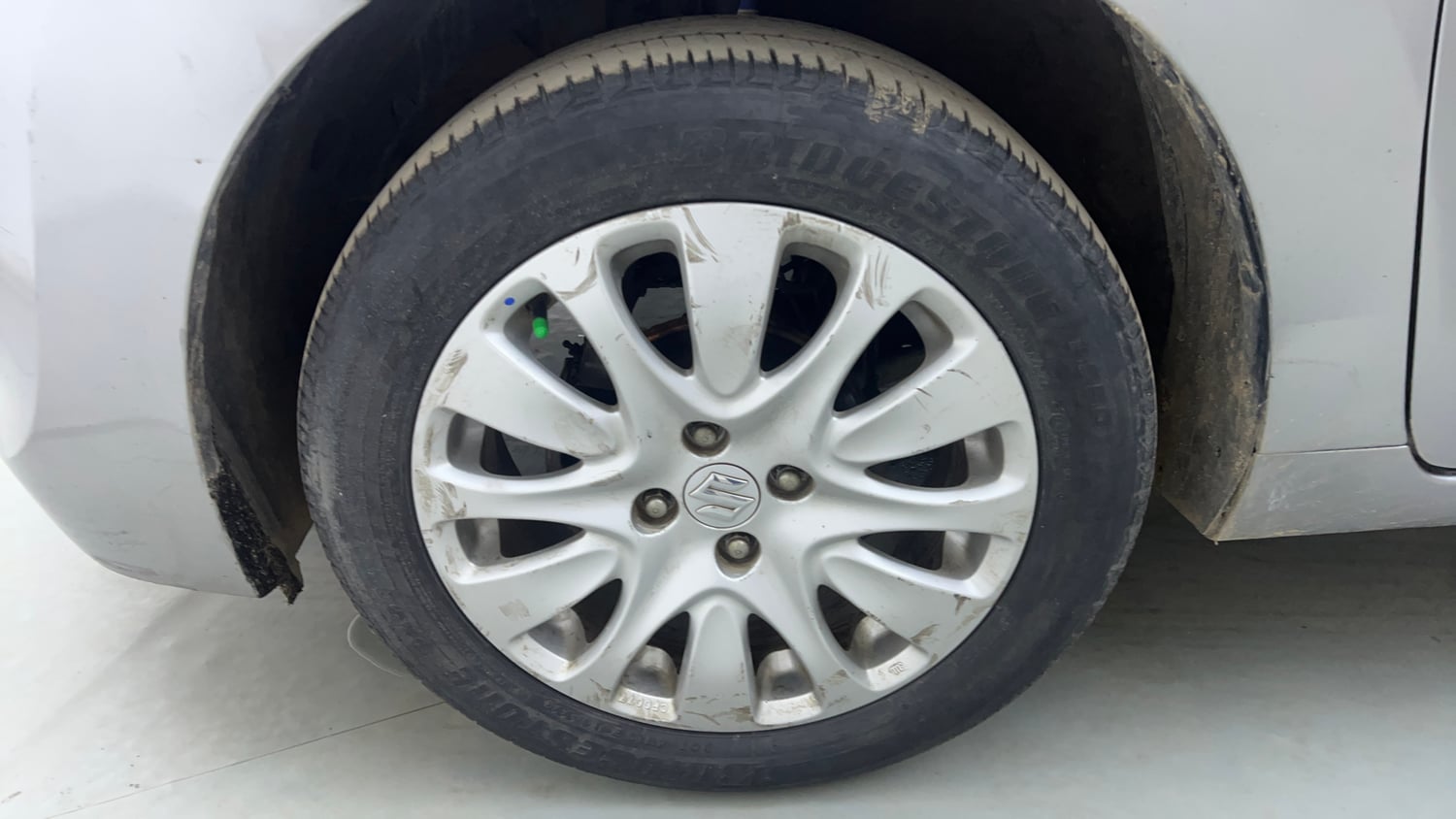 Used 2015 Maruti Suzuki Baleno Alpha 1.2 Petrol Manual tyres LEFT FRONT TYRE RIM VIEW