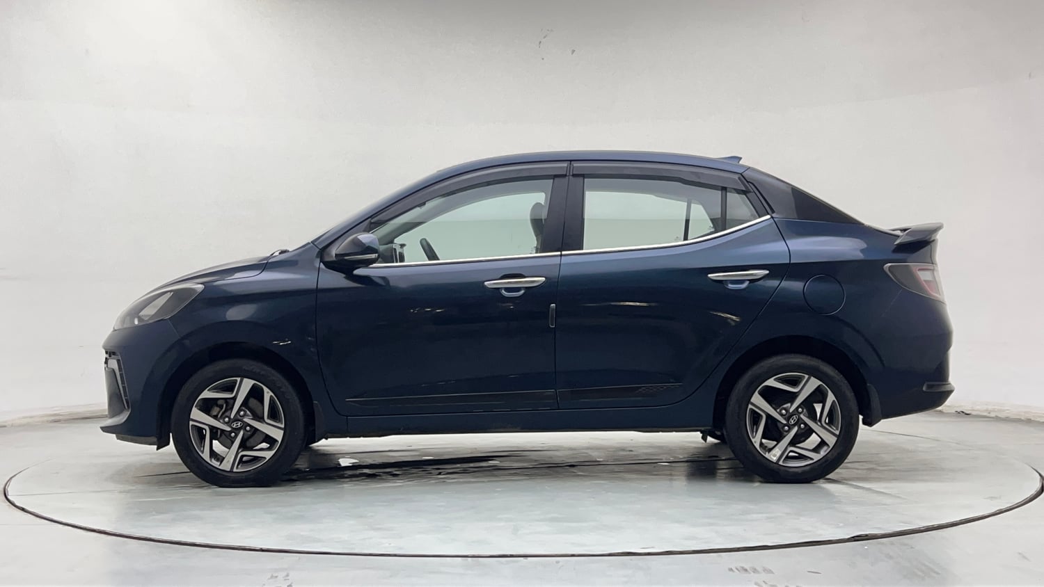 Used 2023 Hyundai Aura SX 1.2 CNG Cng Manual exterior LEFT SIDE VIEW