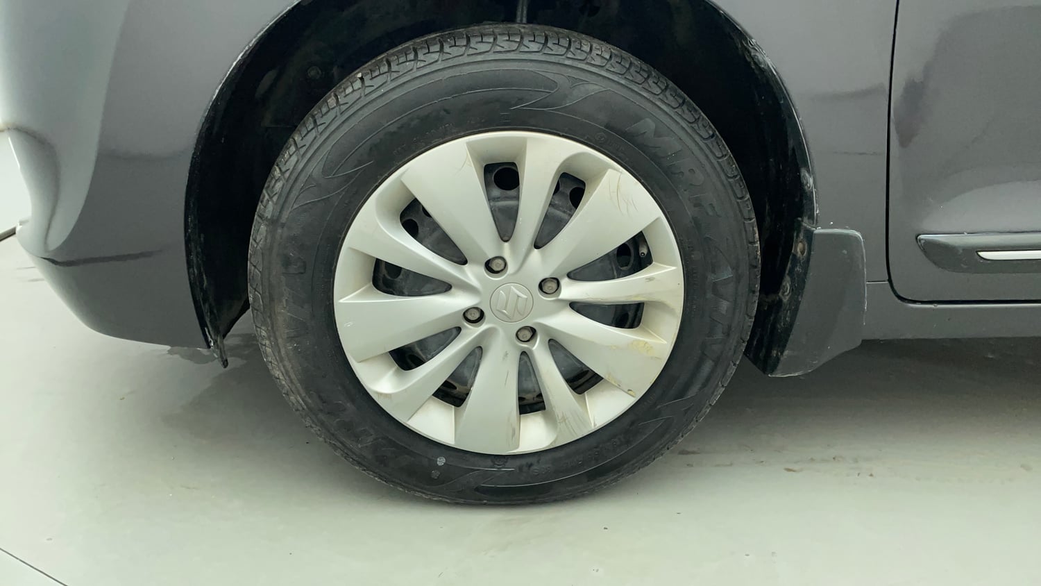 Used 2016 Maruti Suzuki Baleno Delta 1.2 Petrol Manual tyres LEFT FRONT TYRE RIM VIEW