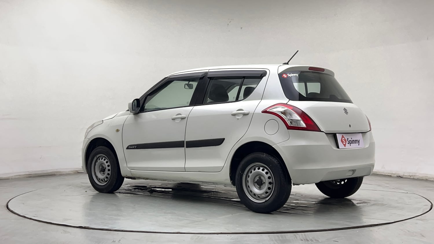 Used 2016 Maruti Suzuki Swift Lxi (O) Petrol Manual exterior LEFT REAR CORNER VIEW