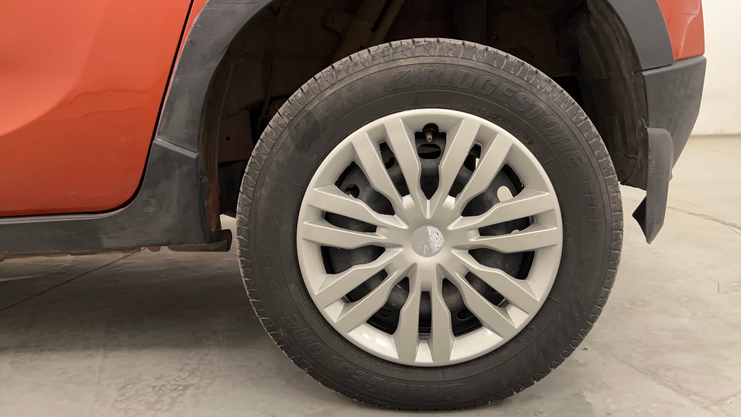Used 2016 Mahindra KUV100 K4 5 STR Petrol Manual tyres LEFT REAR TYRE RIM VIEW