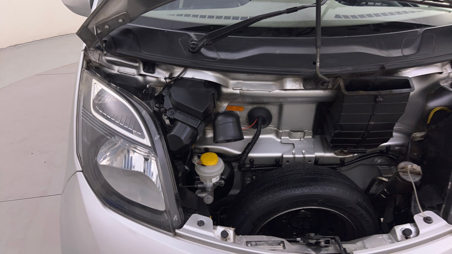 Used 2016 Tata Nano Twist XTA Petrol Automatic engine ENGINE RIGHT SIDE HINGE & APRON VIEW