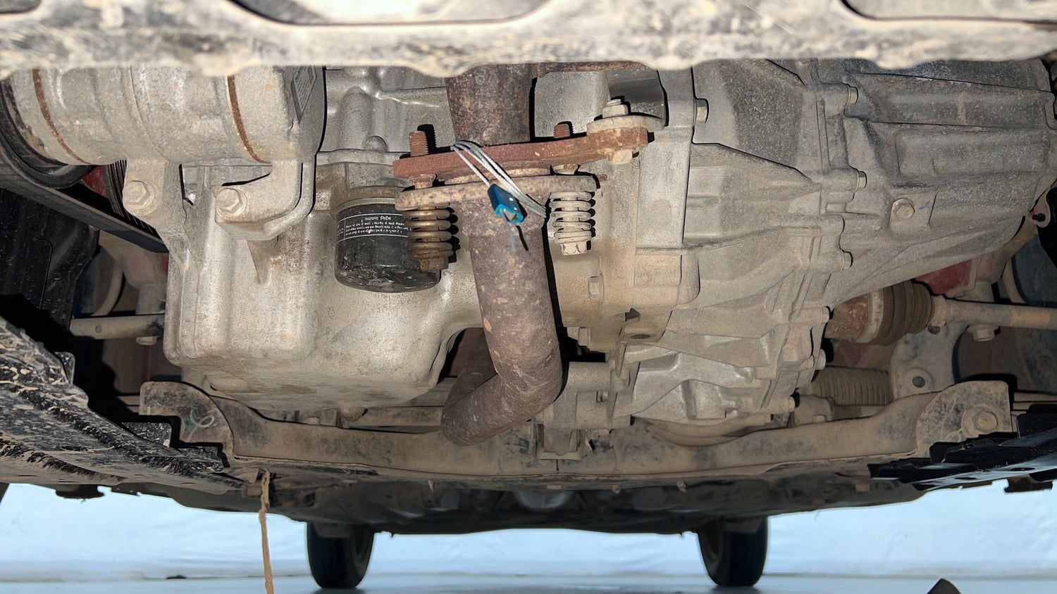 Used 2024 Maruti Suzuki Swift VXi (O) Petrol Manual extra FRONT LEFT UNDERBODY VIEW