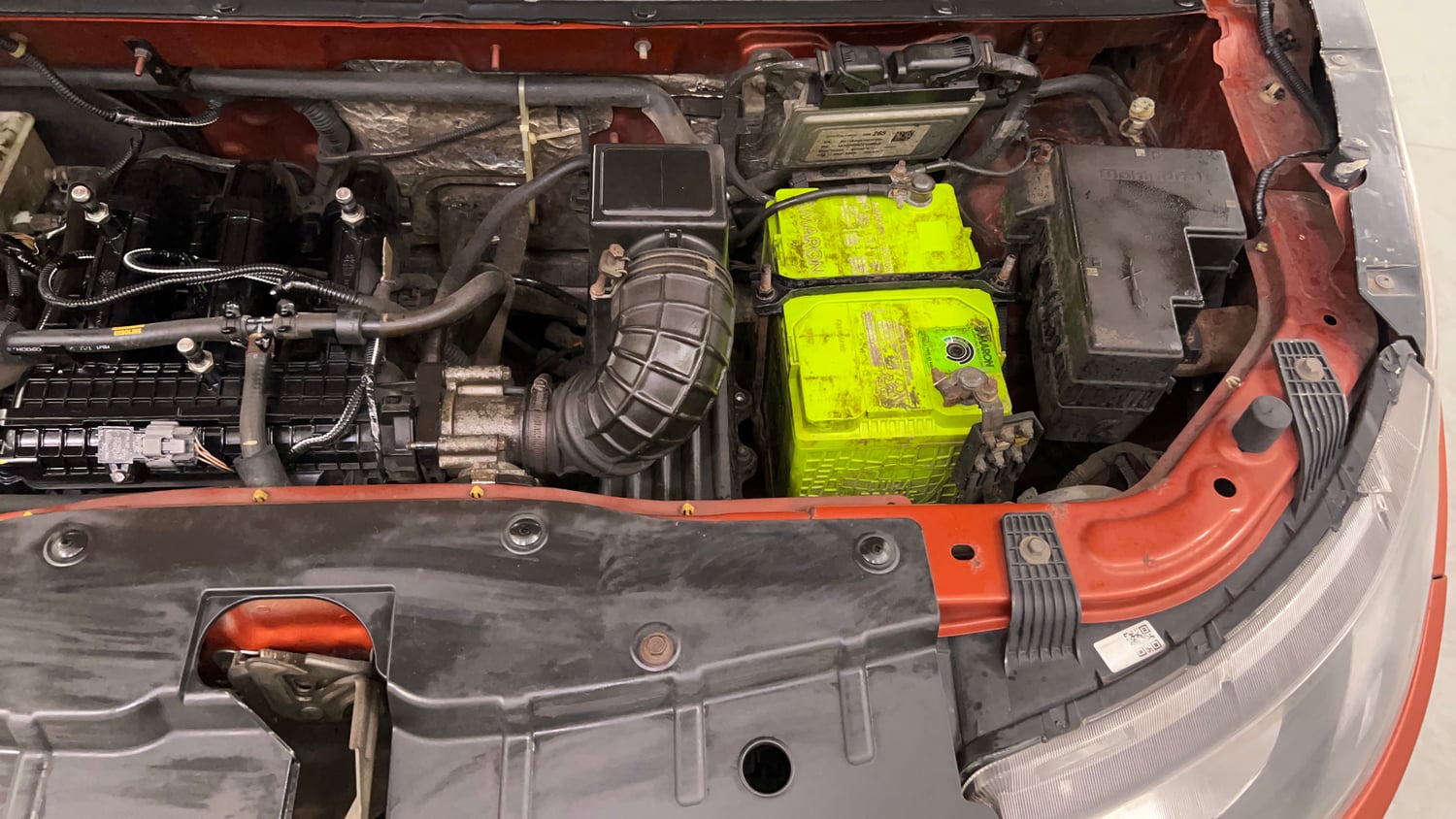 Used 2016 Mahindra KUV100 K4 5 STR Petrol Manual engine ENGINE LEFT SIDE VIEW