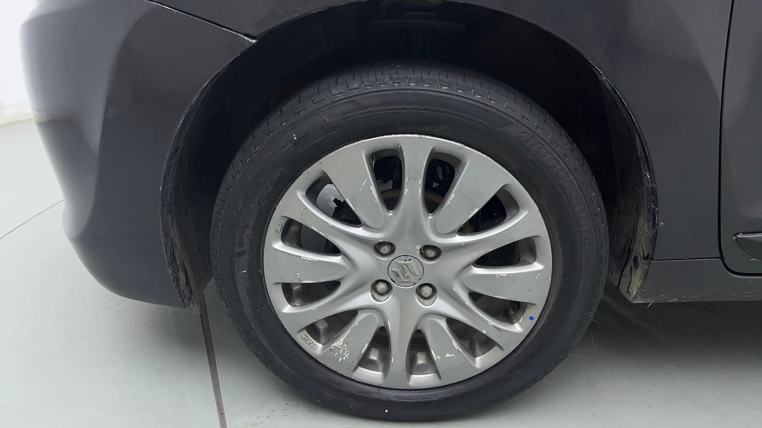 Used 2018 Maruti Suzuki Baleno Zeta 1.2 Petrol Manual tyres LEFT FRONT TYRE RIM VIEW