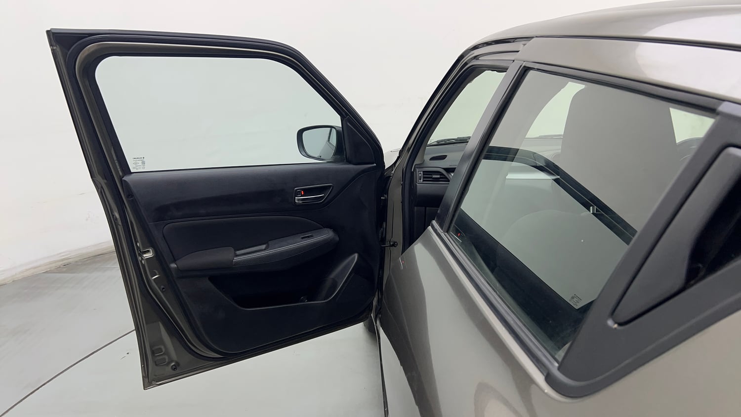 Used 2021 Maruti Suzuki Swift VXi Petrol Manual interior LEFT FRONT DOOR OPEN VIEW