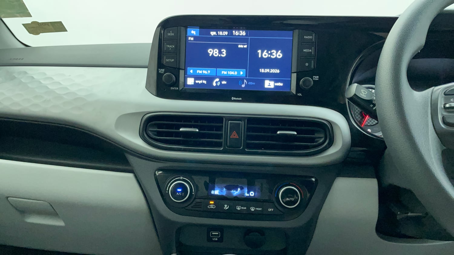 Used 2021 Hyundai Grand i10 Nios Sportz 1.2 Kappa VTVT Petrol Manual interior MUSIC SYSTEM & AC CONTROL VIEW