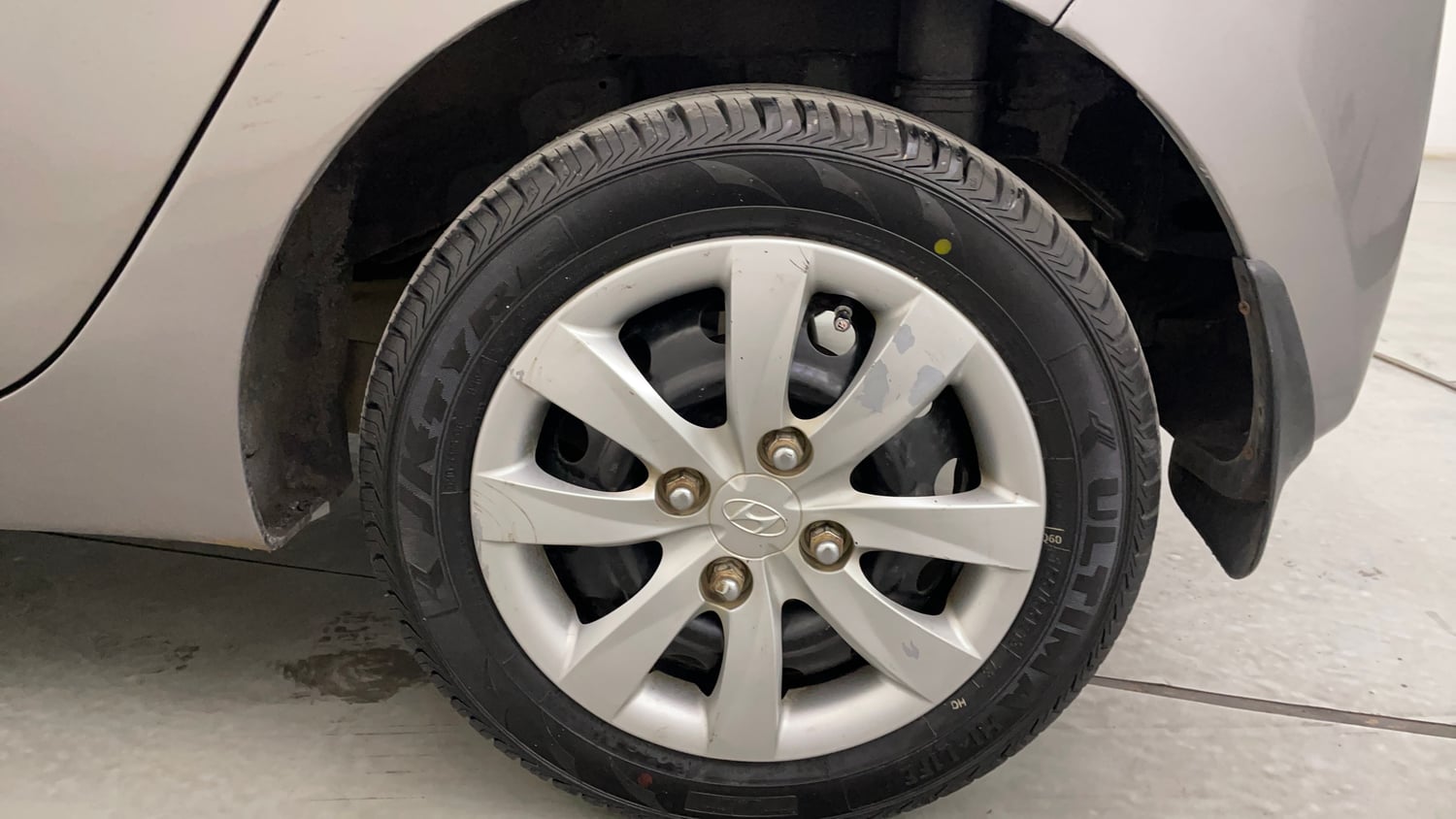 Used 2013 Hyundai Eon Magna Petrol Manual tyres LEFT REAR TYRE RIM VIEW