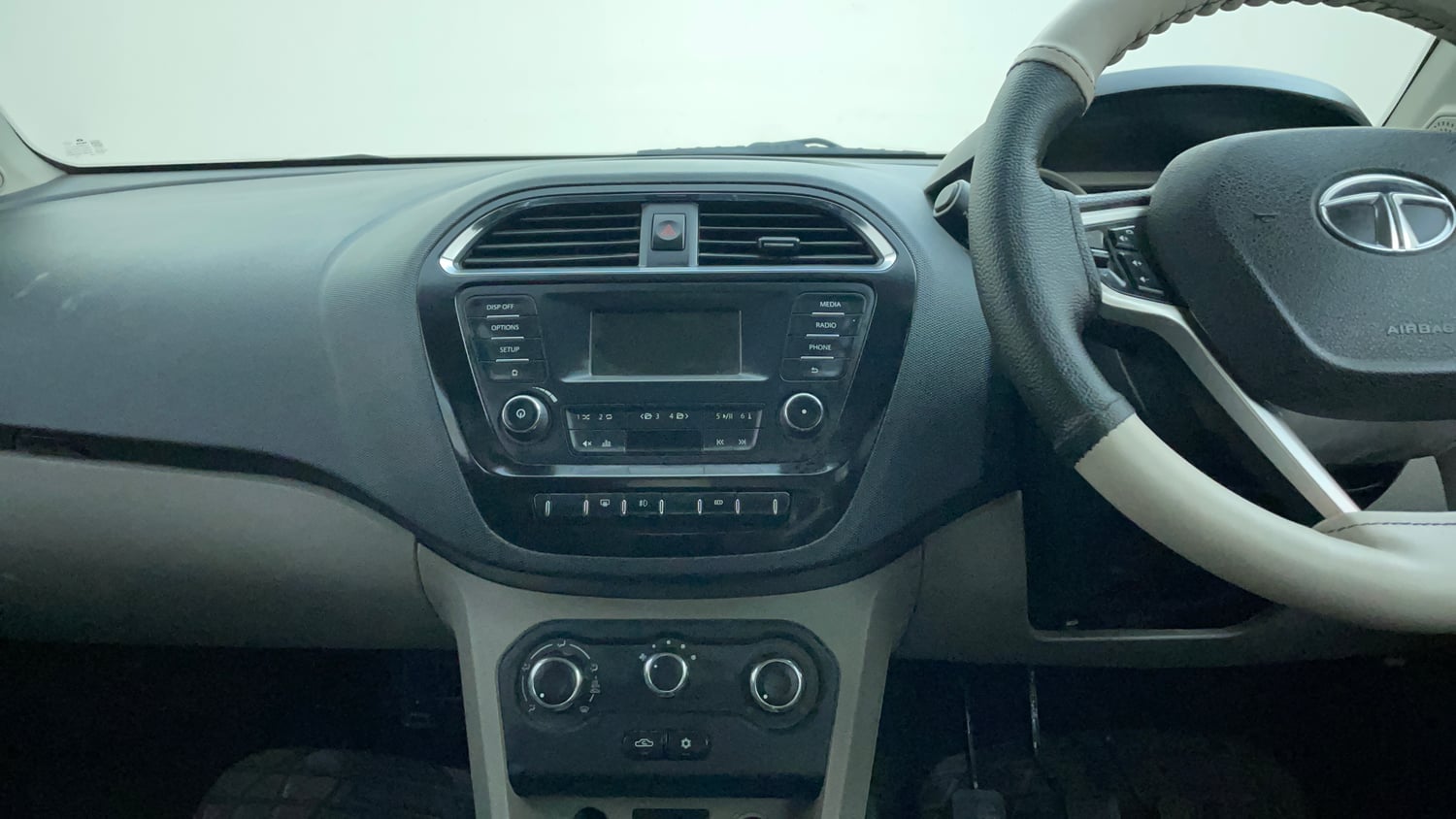 Used 2016 Tata Tiago Revotron XZ Petrol Manual interior MUSIC SYSTEM & AC CONTROL VIEW