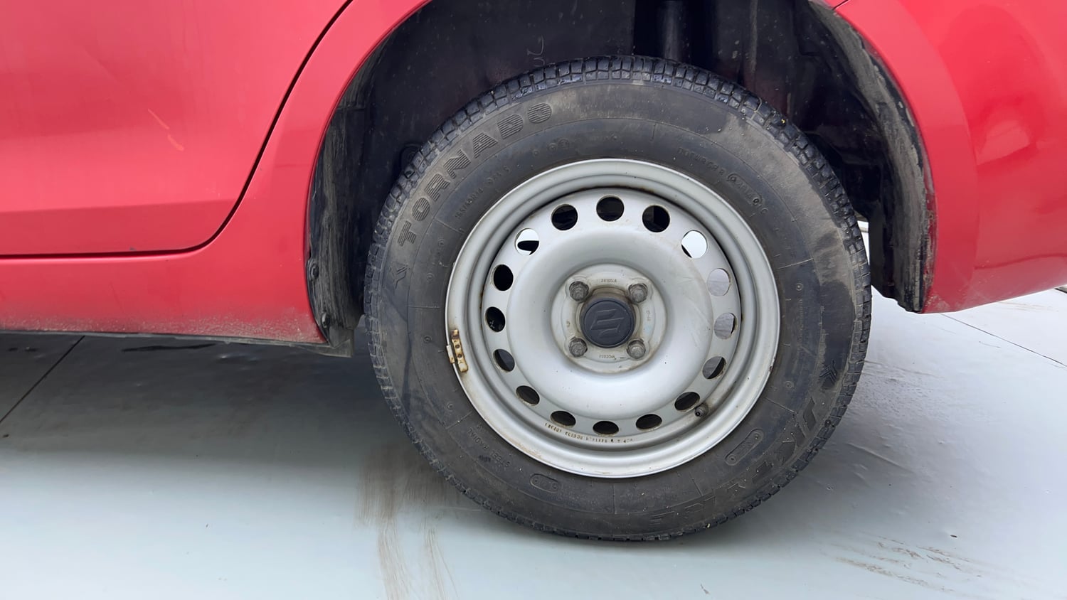 Used 2014 Maruti Suzuki Swift Dzire LXI Petrol Manual tyres LEFT REAR TYRE RIM VIEW