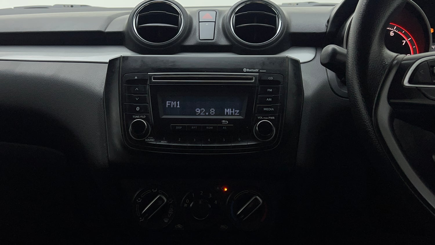 Used 2018 Maruti Suzuki Swift VXi Petrol Manual top_features Integrated (in-dash) music system